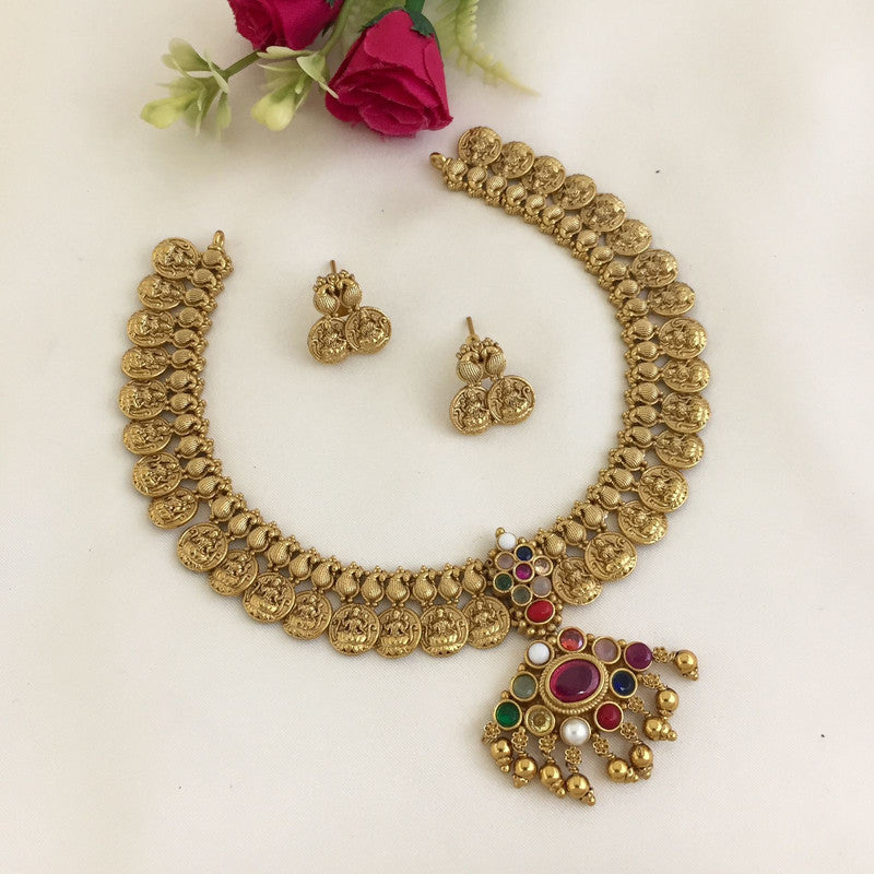 Gold coin necklace set with matching earrings and a multicolored pendant.