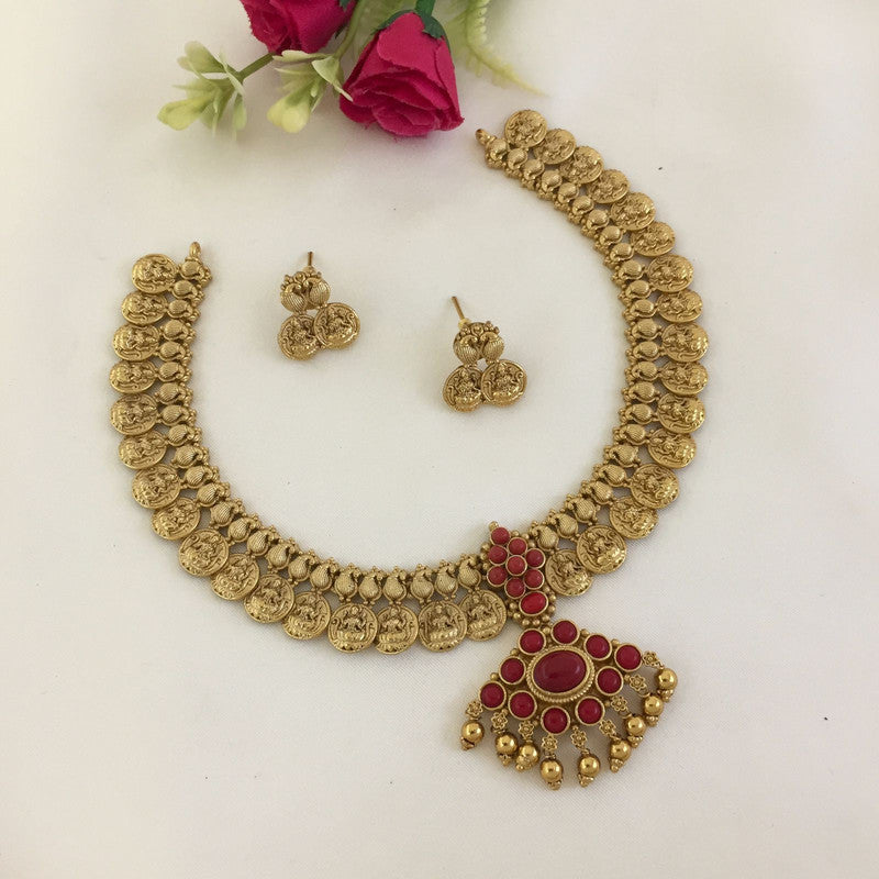 Gold coin necklace set with matching earrings and a pendant featuring red stones.