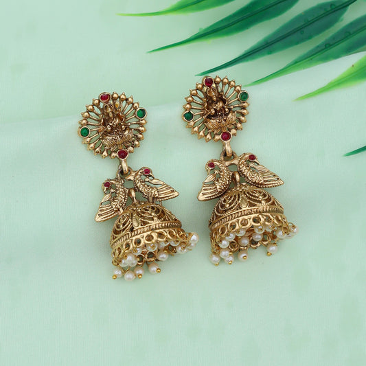 Traditional gold-plated jhumka earrings featuring intricate designs and elegant pearl detailing, perfect for festive occasions.