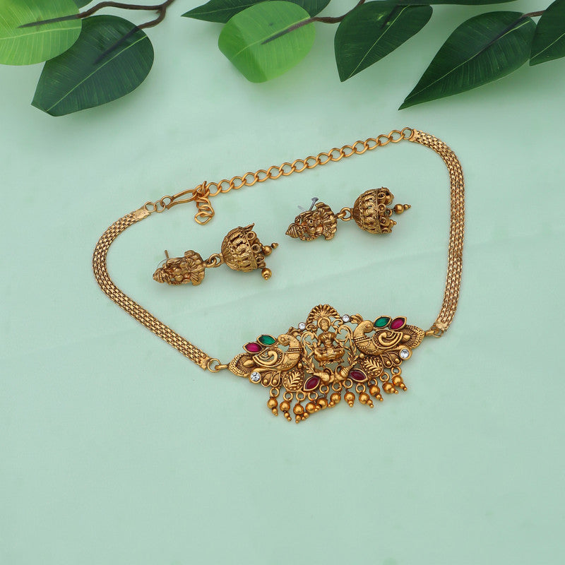 Traditional gold-plated temple jewelry set featuring intricate designs, including matching earrings, perfect for festive occasions and celebrations.