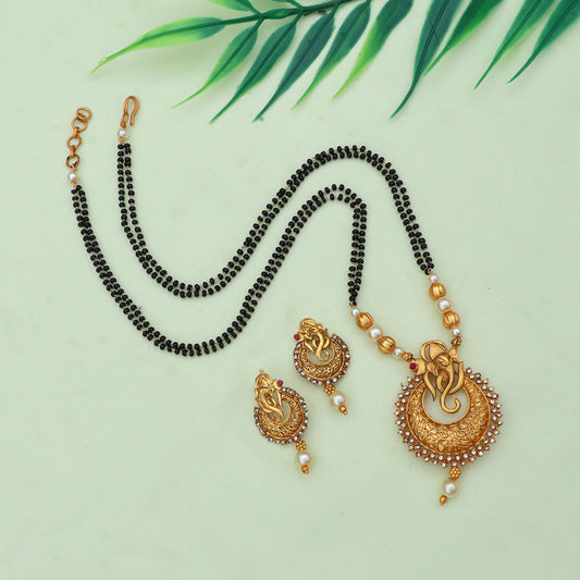 Traditional gold-plated mangalsutra set featuring intricate designs, accompanied by matching earrings, perfect for festive occasions and celebrations.