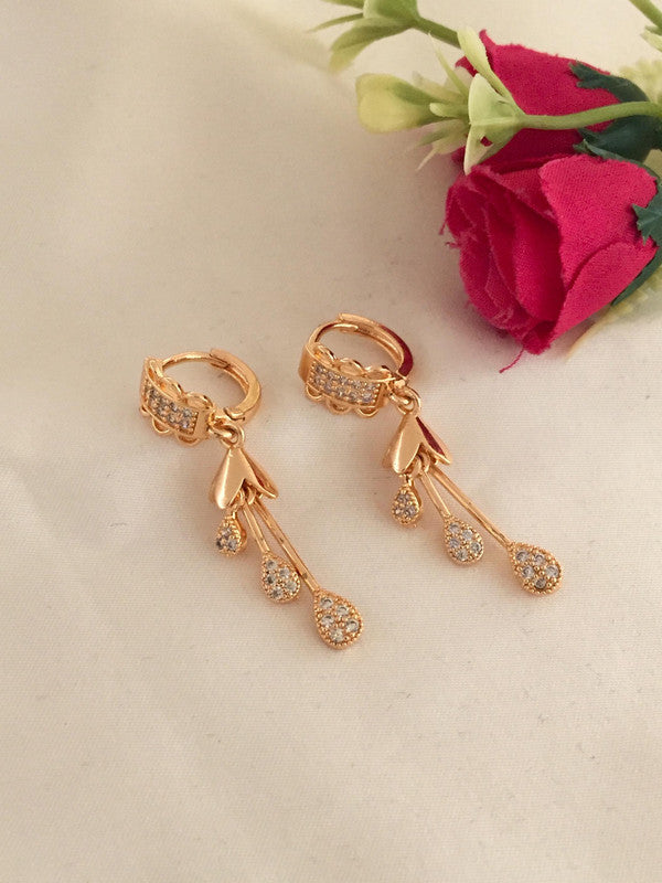 Gold drop earrings with crystal embellishments.