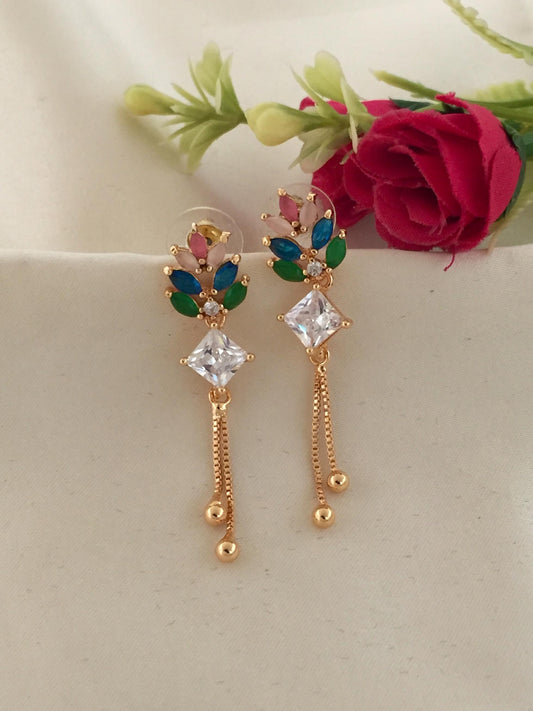 Gold drop earrings with colorful leaf-shaped stones and clear square crystals.